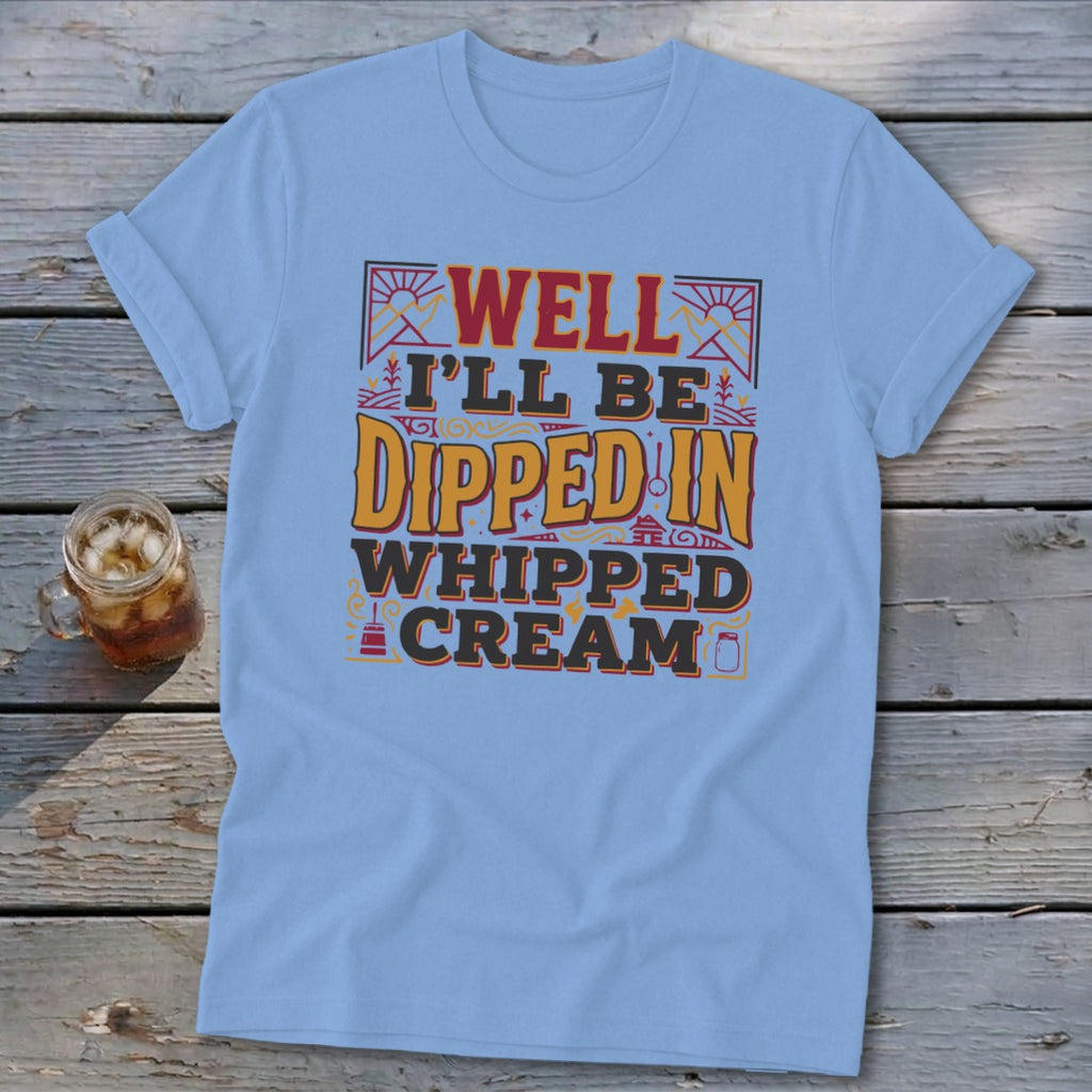 Light blue t-shirt with "Well I'll Be Dipped in Whipped Cream" graphic.