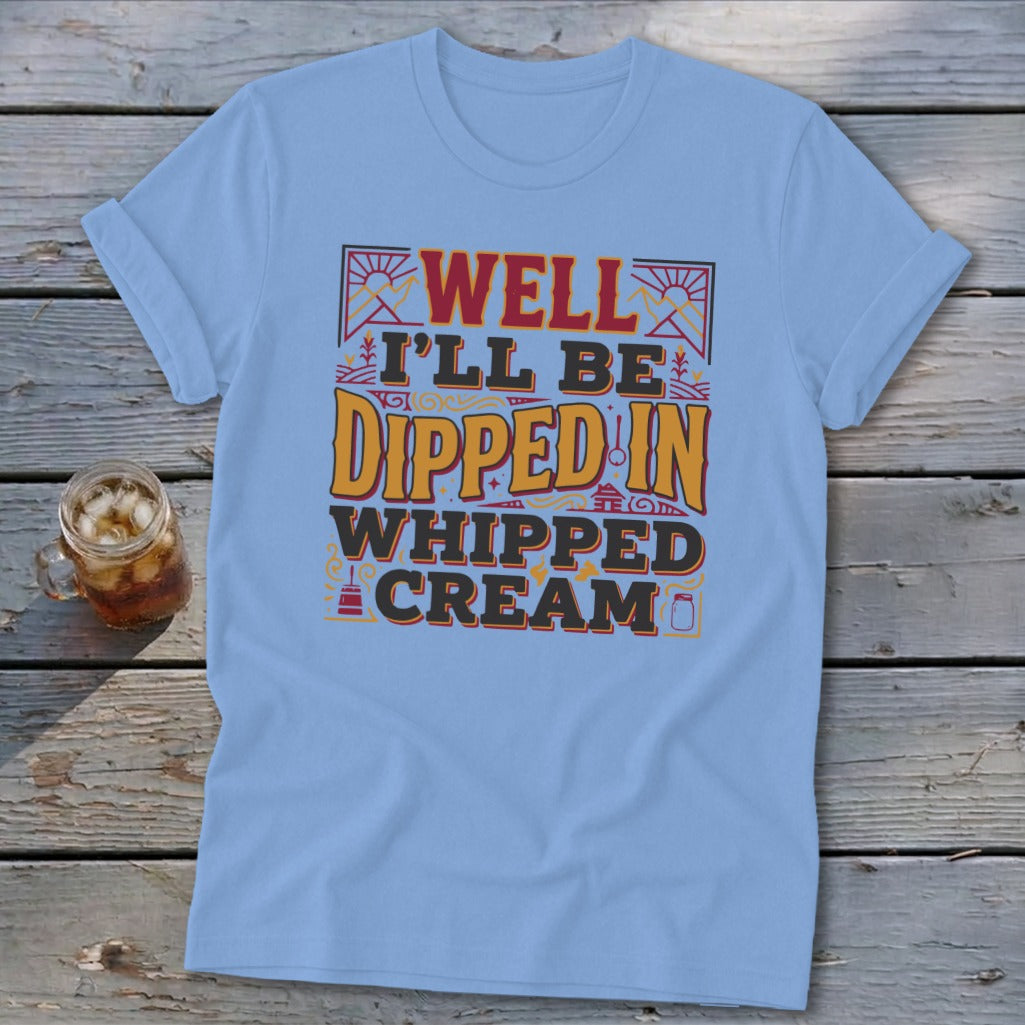 Light blue t-shirt with "Well I'll Be Dipped in Whipped Cream" graphic.