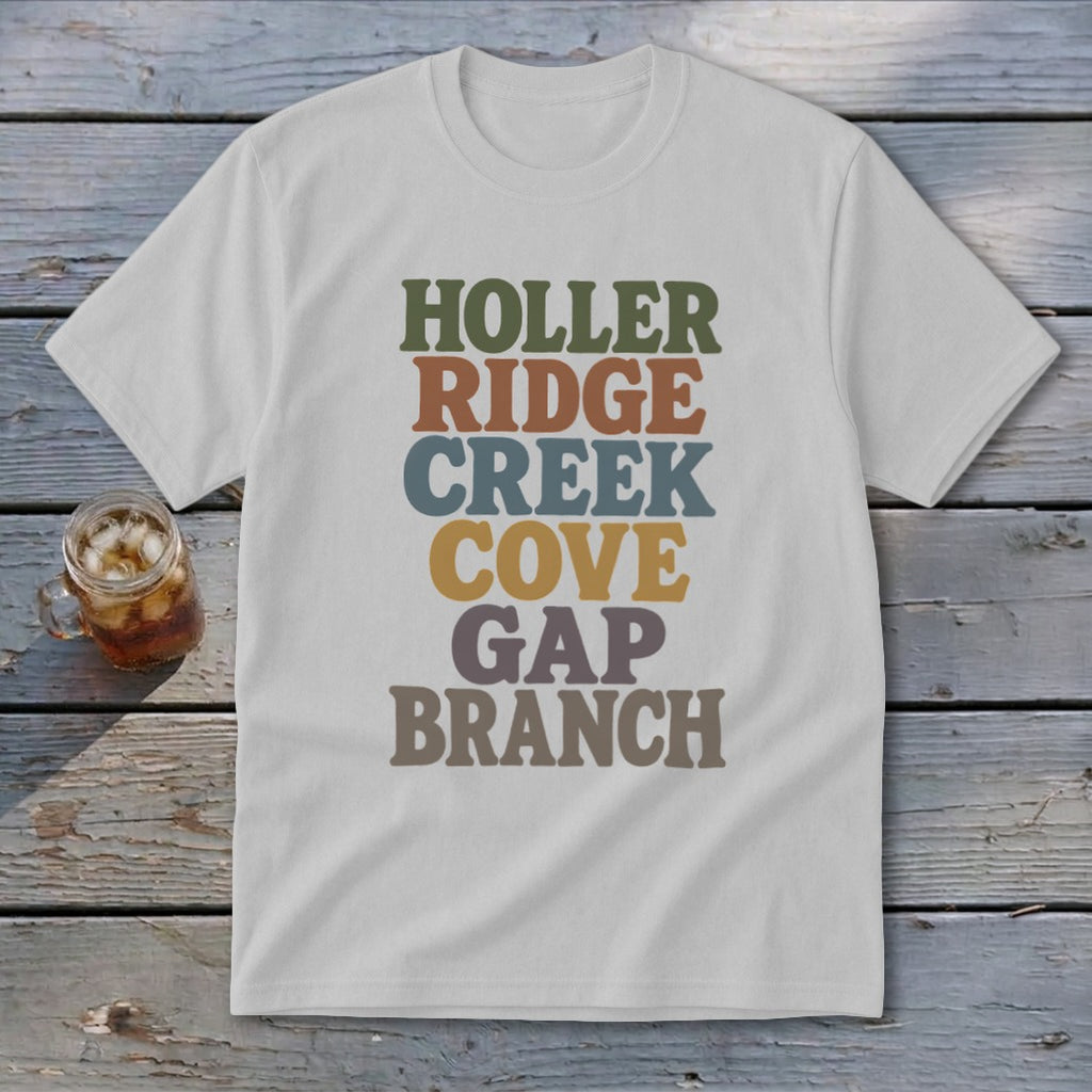 A light gray t-shirt with stacked, multi-colored retro text reading HOLLER RIDGE CREEK COVE GAP BRANCH.