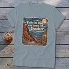 T-shirt graphic: Autumn road to a house, reads "Took the long way home for October".