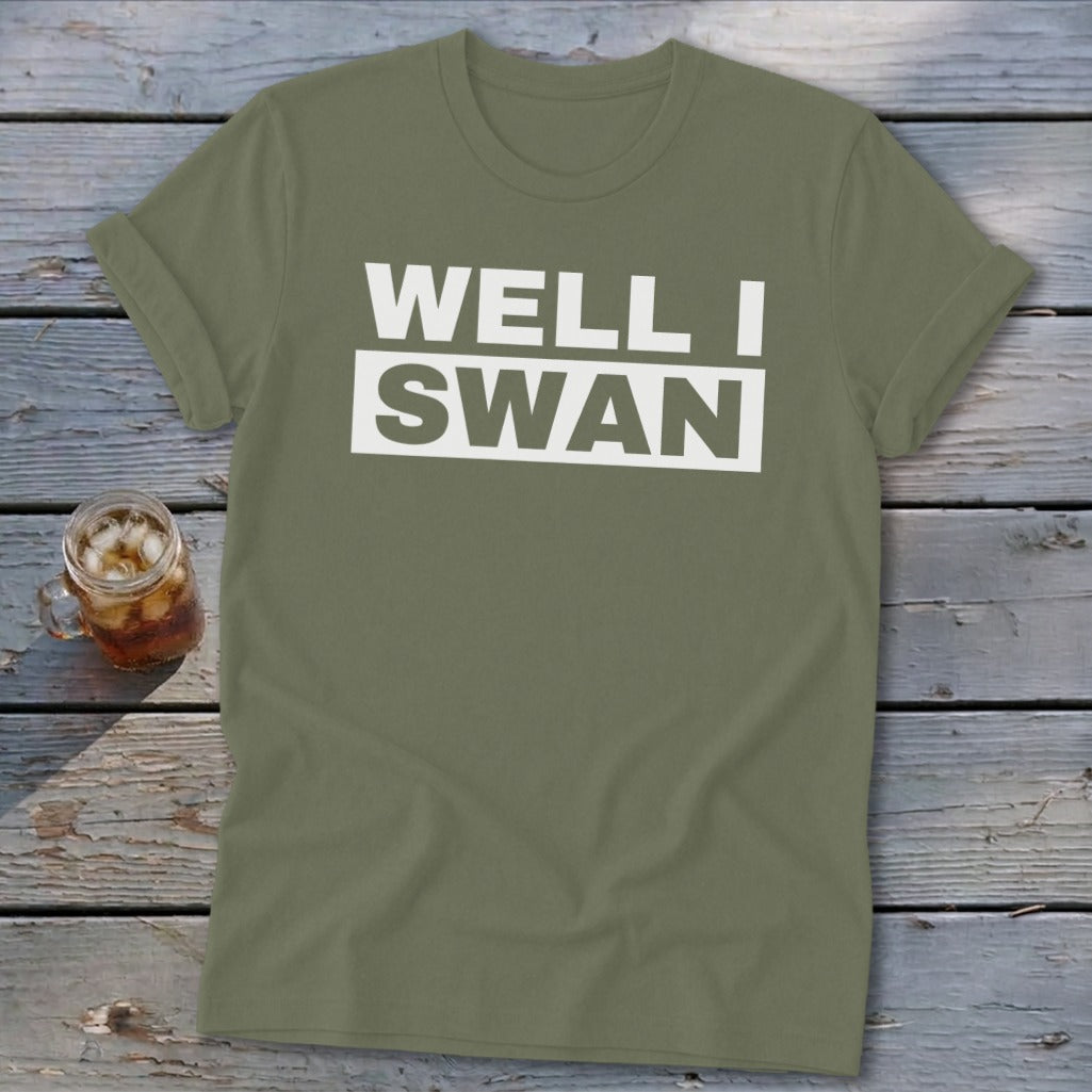 Olive green crewneck t-shirt with rolled sleeves featuring white text that reads WELL I SWAN.