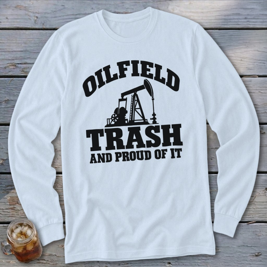 White long-sleeve shirt with black graphic: "Oilfield Trash And Proud Of It."