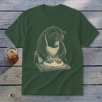 Bear wearing apron kneading dough on wooden board, printed on dark green t-shirt.