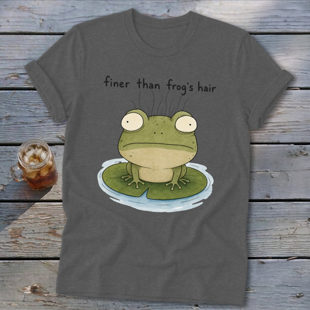 A dark gray t-shirt with a cartoon frog on a lily pad and the text "finer than frog's hair".