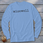 Light blue long sleeve shirt with black text "mizewell" and a glass of iced tea.
