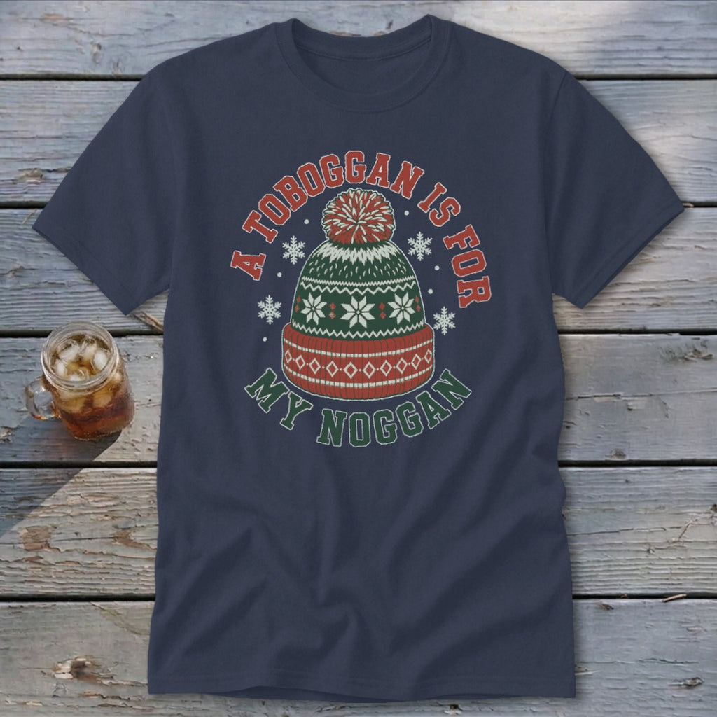 A navy t-shirt featuring a green, red, and white knit winter hat graphic with text.