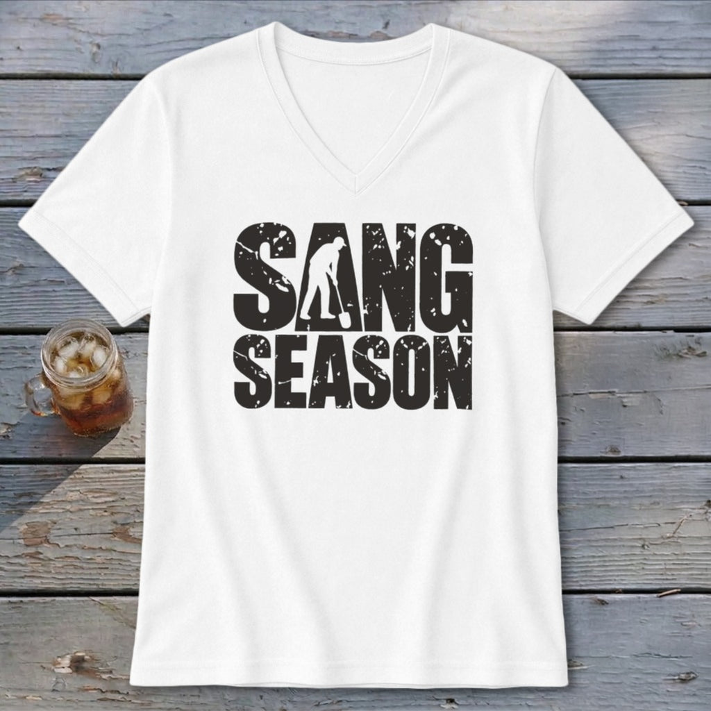 A white V-neck t-shirt featuring the distressed black text "SANG SEASON" and a graphic of a person digging.
