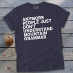 Dark blue t-shirt with white text: "Anymore people just don't understand mountain grammar."