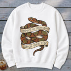 White sweatshirt with coiled snake graphic and banners reading "Respect the Mountains" and "Watch Your Step."