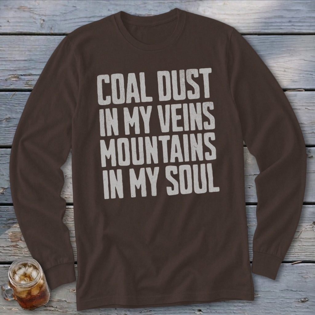 Brown long-sleeve shirt with the text COAL DUST IN MY VEINS MOUNTAINS IN MY SOUL printed in white.