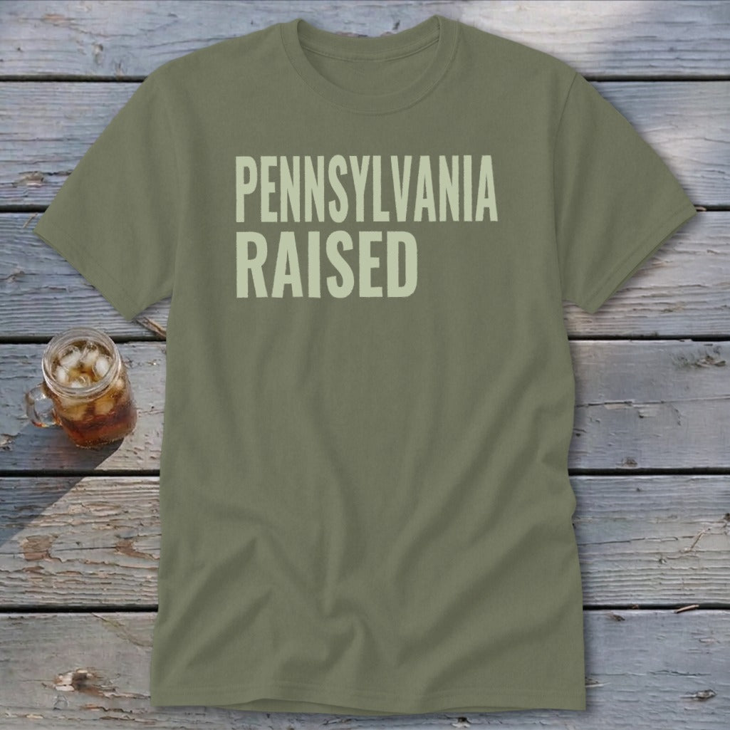 Olive green t-shirt with "PENNSYLVANIA RAISED" text in light beige.