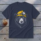 Black bear wearing a yellow miner's helmet with a light on a navy t-shirt.
