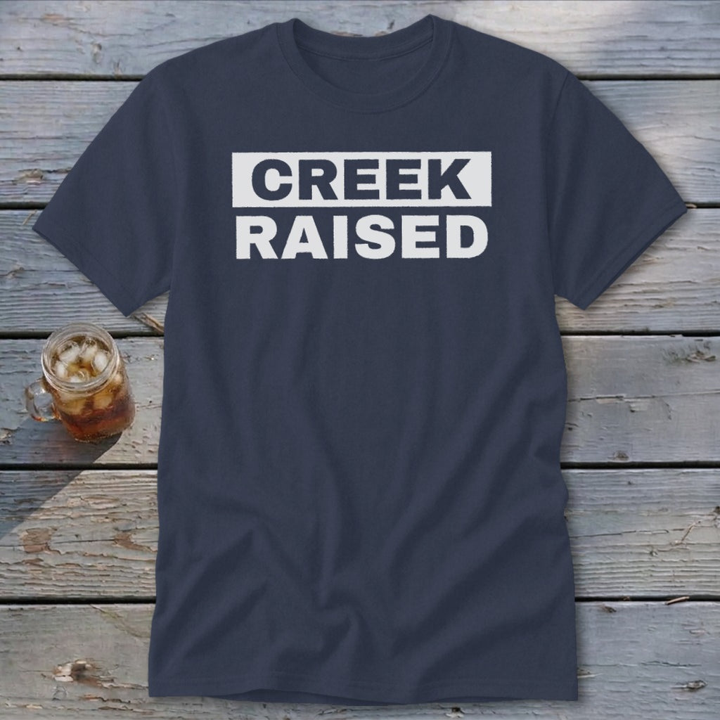 Navy t-shirt with white text that reads "CREEK RAISED".