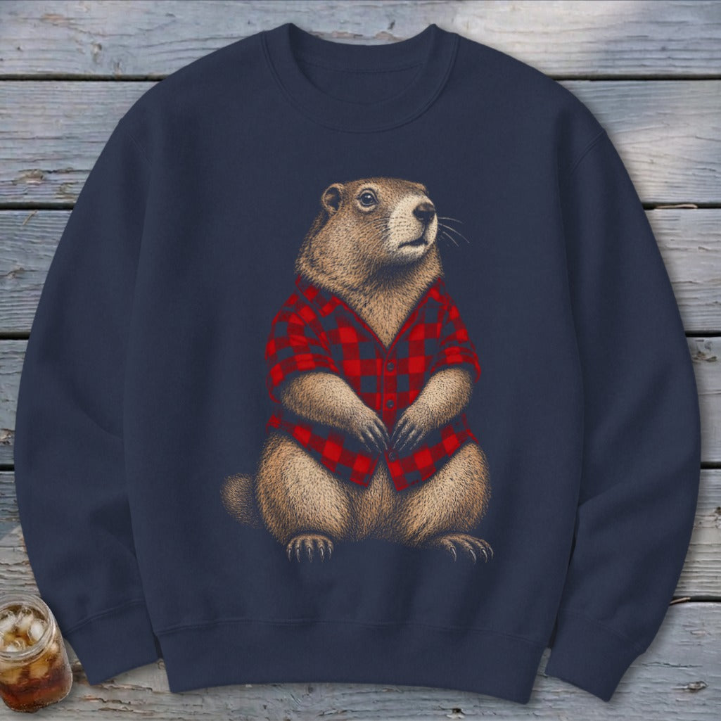 Groundhog wearing red and black plaid shirt on dark navy sweatshirt.