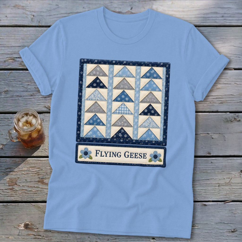 Light blue t-shirt with a quilt design and text "FLYING GEESE".