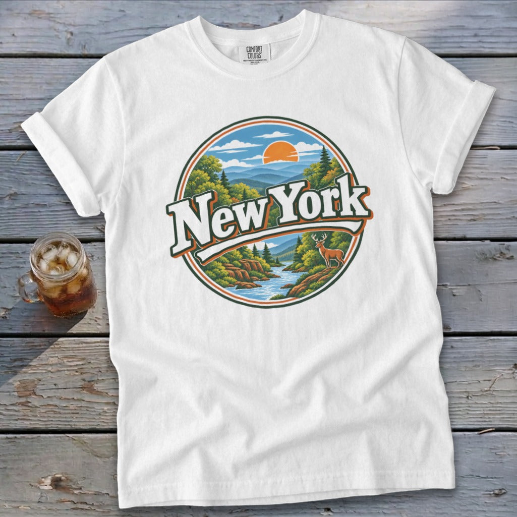 White t-shirt with a circular graphic of a New York landscape with a deer.