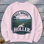 Pink sweatshirt with graphic "All Roads Lead to the Holler" over a winding mountain road.