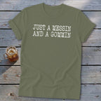 Olive green t-shirt with white text "JUST A MESSIN AND A GOMMIN".