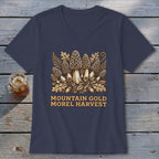 T-shirt with morel mushrooms, acorns, and fern graphic with "MOUNTAIN GOLD MOREL HARVEST" text.