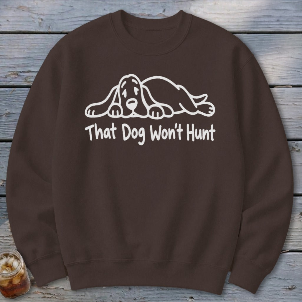 Brown sweatshirt with a white graphic of a sleeping basset hound and the text That Dog Won't Hunt.