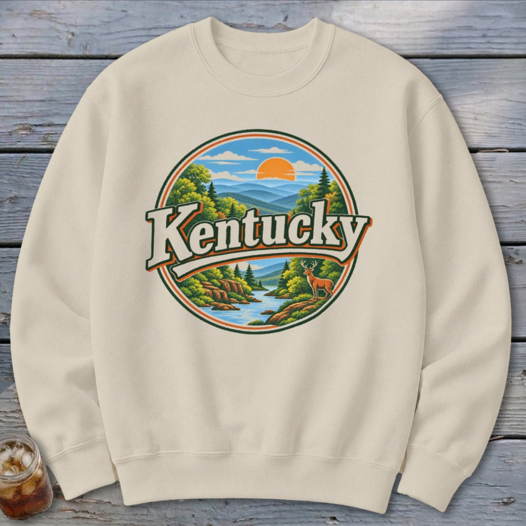 Cream sweatshirt with round vintage Kentucky landscape graphic and deer.