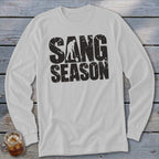 Light gray long-sleeve t-shirt with black distressed text that reads SANG SEASON and includes a silhouetted digger.