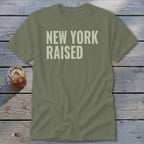Olive green t-shirt with "NEW YORK RAISED" text.