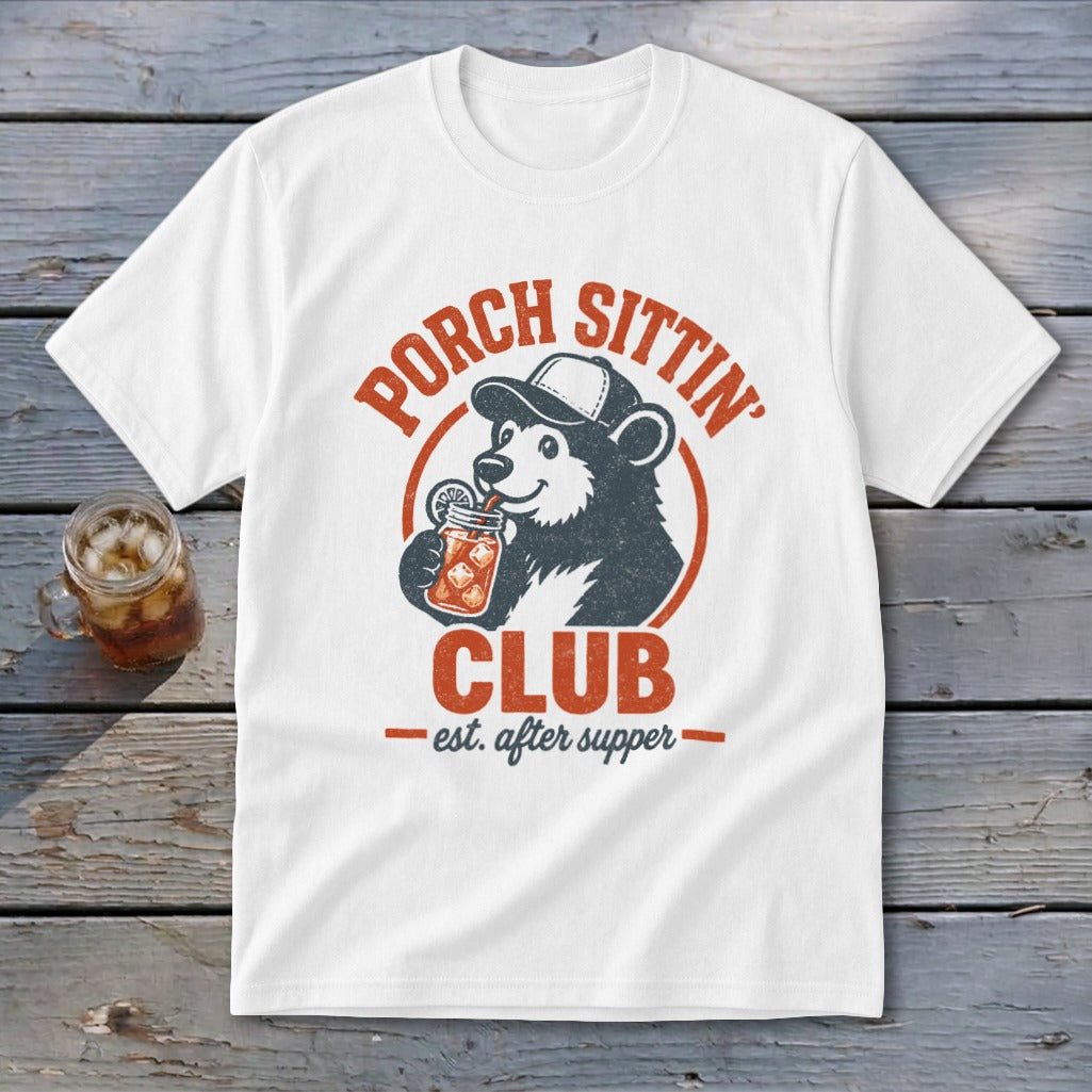 White t-shirt with a bear wearing a hat and drinking from a jar, with text "Porch Sittin' Club est. after supper".