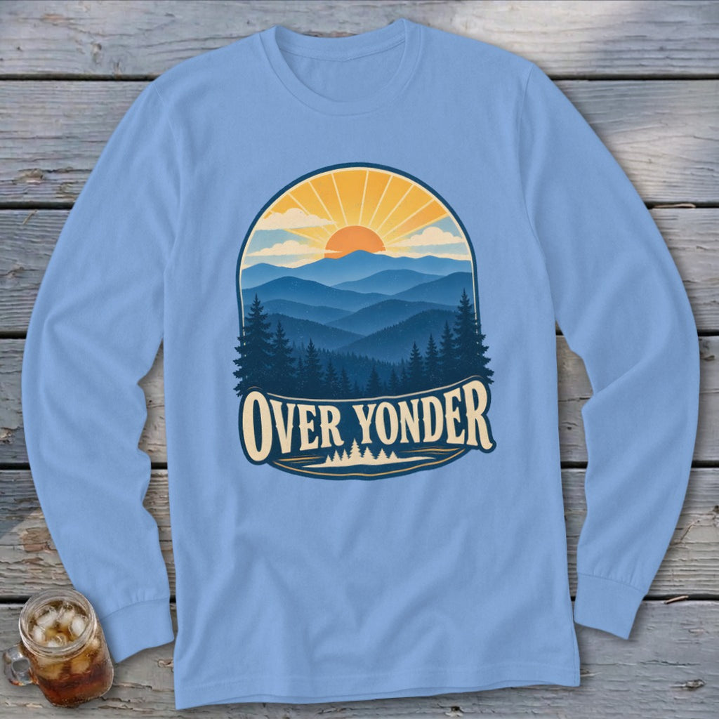 Light blue long-sleeve shirt featuring a sunset mountain graphic and the text OVER YONDER.