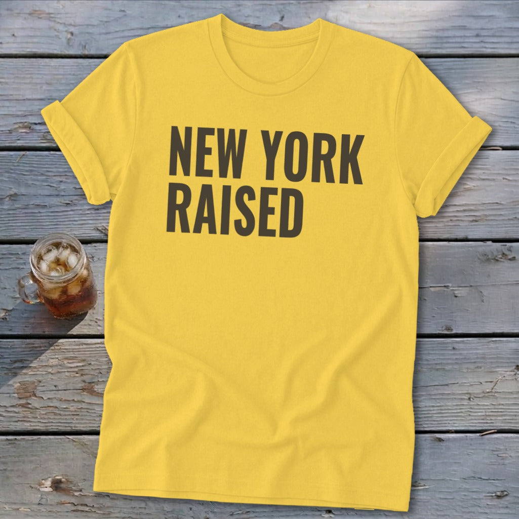 Yellow t-shirt with "NEW YORK RAISED" text in dark gray.