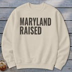 Cream crewneck sweatshirt with "MARYLAND RAISED" in dark grey block letters.
