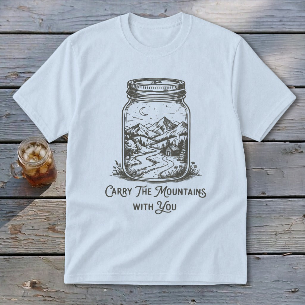 Light blue t-shirt featuring a mason jar illustration filled with a mountain landscape and text Carry The Mountains With You.