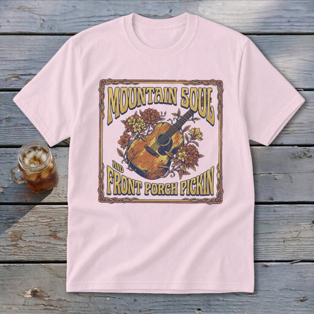 Pink t-shirt with "Mountain Soul" and "Front Porch Pickin'" text and guitar graphic.