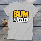 A light gray t-shirt with rolled sleeves displaying the text BUM FUZZLED across the chest.