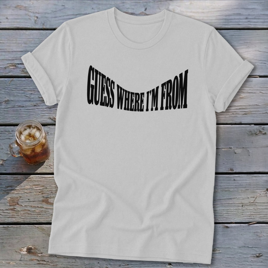 White t-shirt with black text that reads "GUESS WHERE I'M FROM".