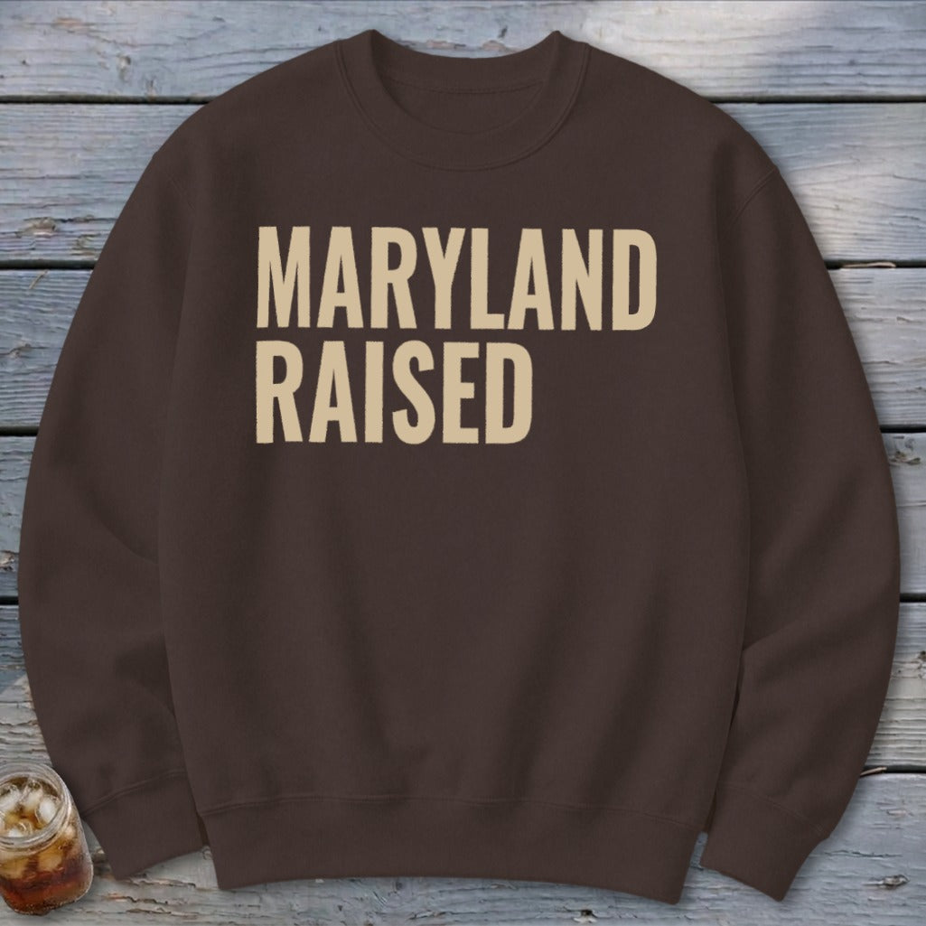 Brown sweatshirt with "MARYLAND RAISED" in beige text.