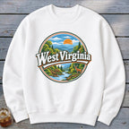 White sweatshirt with circular West Virginia mountain landscape graphic featuring a deer.