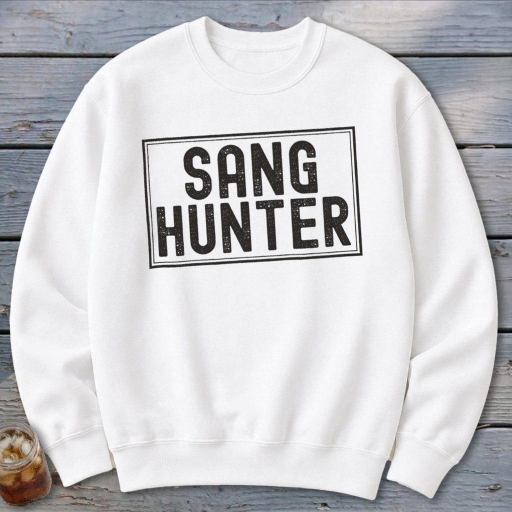 White sweatshirt with black text "SANG HUNTER" inside a black rectangle.