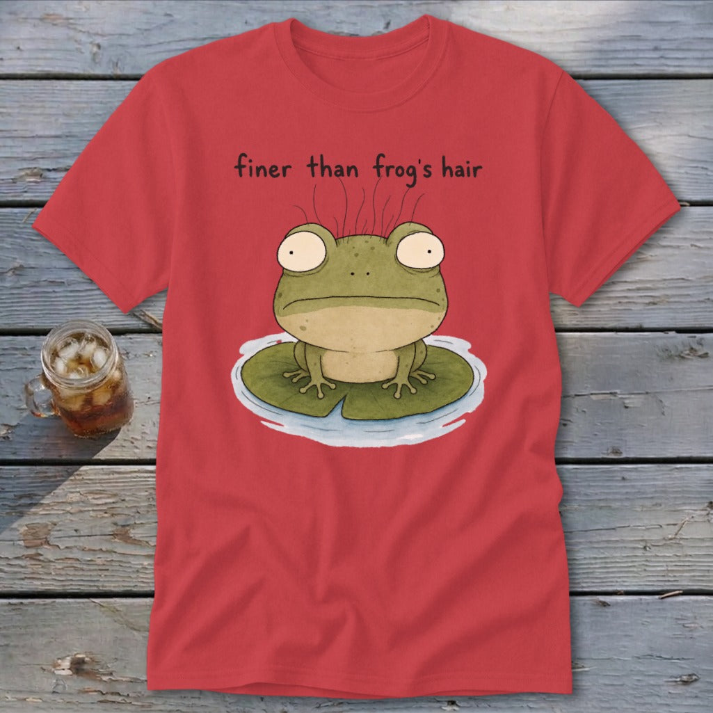 A red t-shirt printed with a cartoon frog on a lily pad and the text "finer than frog's hair".