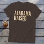 Brown t-shirt with "ALABAMA RAISED" text and a glass of iced tea.