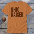 Orange t-shirt with "OHIO RAISED" text in dark brown letters.