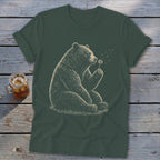 Dark green t-shirt featuring a drawing of a bear blowing on a dandelion.
