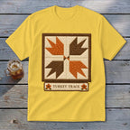 Yellow t-shirt with a brown-bordered quilt square design and "Turkey Track" text.