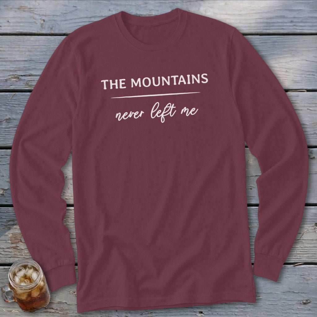 Maroon long-sleeve shirt with white text "The Mountains never left me"