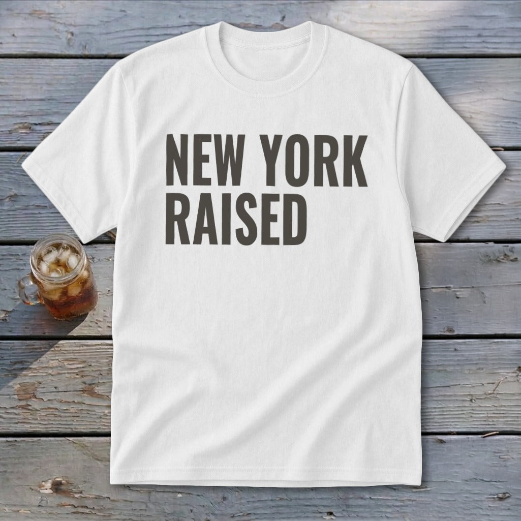 White t-shirt with "NEW YORK RAISED" text and a glass of iced tea.