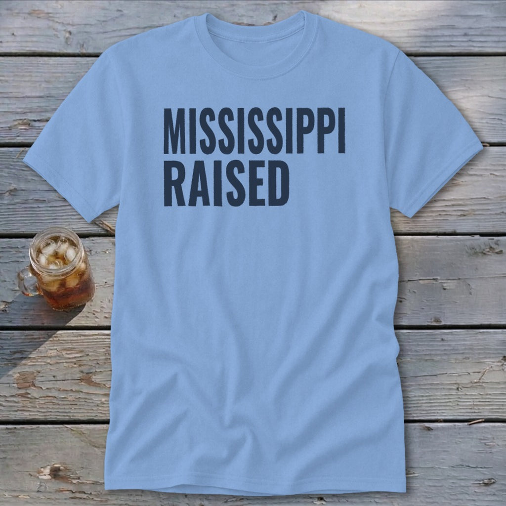 Light blue t-shirt with "MISSISSIPPI RAISED" text.