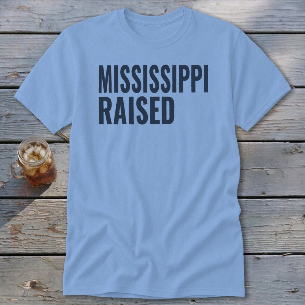 Light blue t-shirt with "MISSISSIPPI RAISED" text.