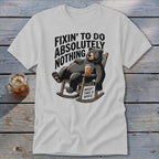 Light gray t-shirt with a cartoon bear lounging in a rocking chair holding a drink, with humorous text.