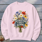 Pink sweatshirt with a floral bouquet and "Decoration Day Blooms" text.