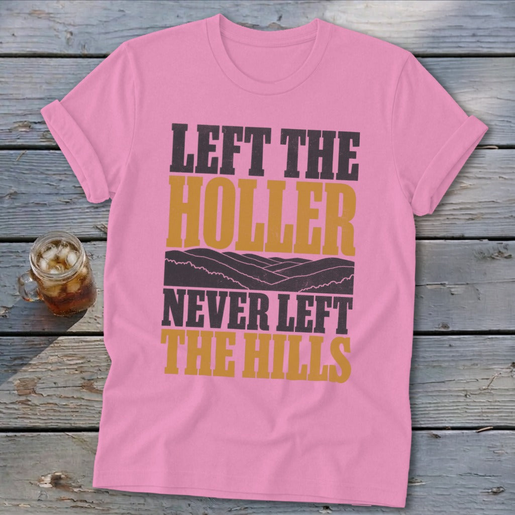 Pink t-shirt with "Left the holler, never left the hills" text and mountain graphic.